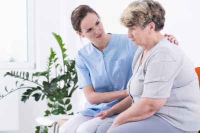 caregiver taking care of the old lady